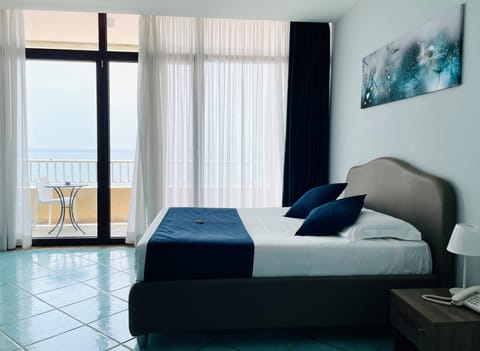 Double Room, Sea View | Down comforters, minibar, in-room safe, individually decorated