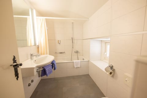 Family Room (Superior) | Bathroom | Deep soaking tub, hair dryer, towels