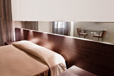 Classic Double or Twin Room | Minibar, in-room safe, desk, laptop workspace