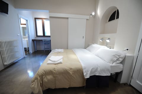 Frette Italian sheets, down comforters, Select Comfort beds