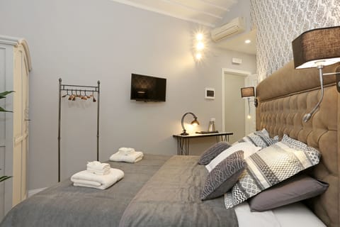 Deluxe Quadruple Room, 1 Bedroom, Refrigerator | 1 bedroom, premium bedding, in-room safe, desk