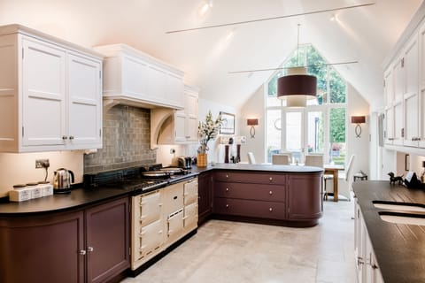 Fully equipped kitchen overlooking pool and hot tub terrace