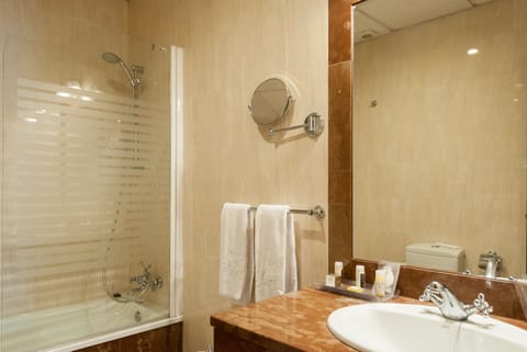 Combined shower/tub, designer toiletries, hair dryer, bathrobes