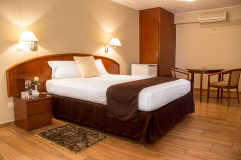 Superior Suite | Down comforters, minibar, in-room safe, individually furnished