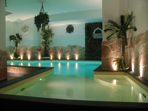 Indoor pool, outdoor pool, pool umbrellas, sun loungers