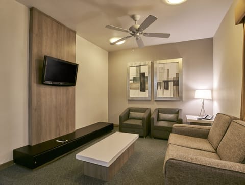 Suite, Multiple Beds | Living area | Flat-screen TV