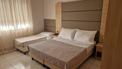 Family Quadruple Room | In-room safe, desk, rollaway beds, free WiFi