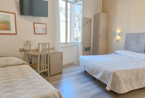 Triple Room | Down comforters, minibar, desk, blackout drapes