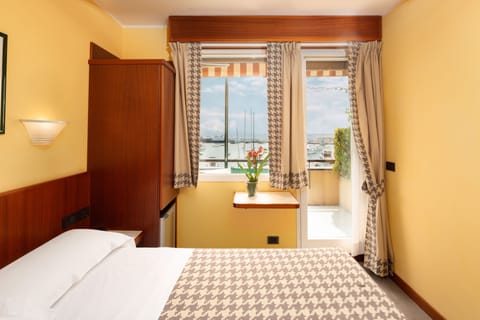 Single Room, Balcony, Sea View | Down comforters, minibar, in-room safe, desk