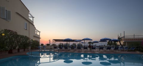 Seasonal outdoor pool, pool umbrellas, sun loungers