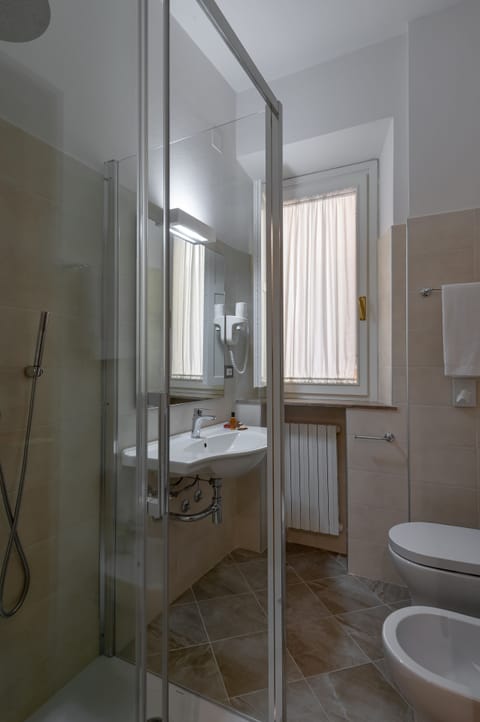 Single Room | Bathroom | Deep soaking tub, rainfall showerhead, hair dryer, bidet