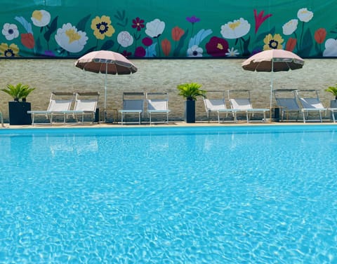 Seasonal outdoor pool, open 8:30 AM to 7:30 PM, pool umbrellas