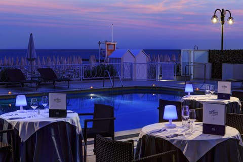 Breakfast, lunch, dinner served; Italian cuisine, pool views 