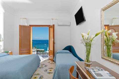 Triple Room, Balcony, Sea View | Down comforters, minibar, in-room safe, desk