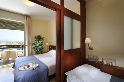 Family Quadruple Room, Sea View | Minibar, in-room safe, desk, free WiFi