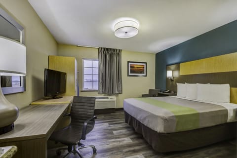 Deluxe Room, 1 Queen Bed, Non Smoking, Kitchenette | Desk, laptop workspace, blackout drapes, iron/ironing board