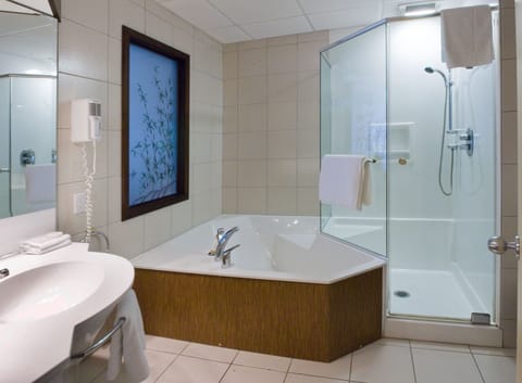 Suite, 1 King Bed | Bathroom | Shower, eco-friendly toiletries, hair dryer, bathrobes