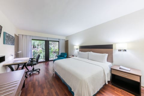 Standard Room, 1 King Bed, Balcony, Pool View | In-room safe, desk, blackout drapes, iron/ironing board
