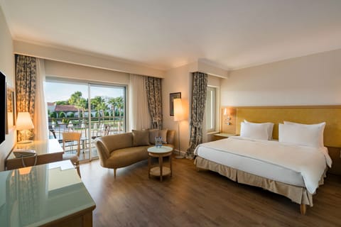 Junior Suite, Balcony, Pool View | 1 bedroom, premium bedding, minibar, desk