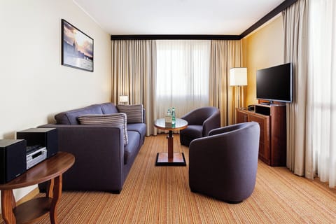 Suite, 1 King Bed with Sofa bed, Balcony | Living room | 42-inch flat-screen TV with cable channels, TV