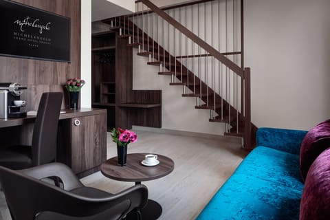 Suite (Two floors) | Living area | 50-cm TV with satellite channels