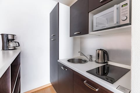 Apartment, 1 Bedroom | Private kitchen | Fridge, microwave, stovetop, coffee/tea maker