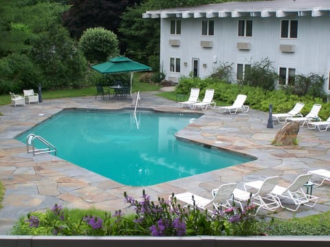 Seasonal outdoor pool, open 9:00 AM to 10:00 PM, pool umbrellas