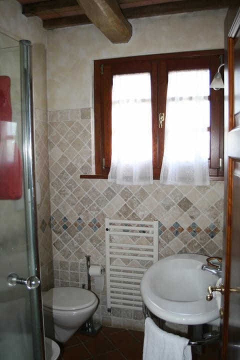 Shower, free toiletries, hair dryer, slippers