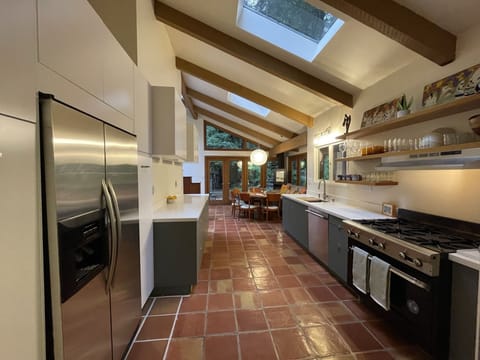 Walking from the dining room into the newly remodeled kitchen.