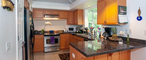 Villas of Kamalii 37 upgraded kitchen - In addition to plenty of counter space, there's a full size fridge/freezer, microwave, drip coffee pot, toaster, pots/pans, dishes/utensils, and a small stock of basic cooking supplies.