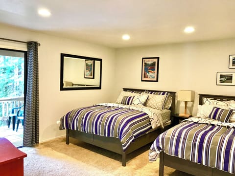 Downstairs Bedroom with Queen and Full Beds with access to lower deck.