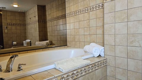 Suite, 1 King Bed, Non Smoking, Jetted Tub | Bathroom | Combined shower/tub, free toiletries, hair dryer, towels