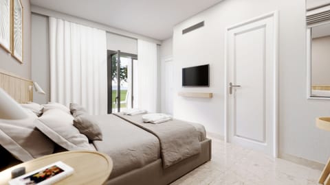Family Room, Garden View | Free minibar, in-room safe, desk, blackout drapes
