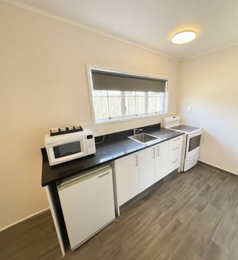 Superior Suite, 1 Bedroom, Non Smoking, Ground Floor | Private kitchen | Fridge, microwave, toaster, cookware/dishes/utensils