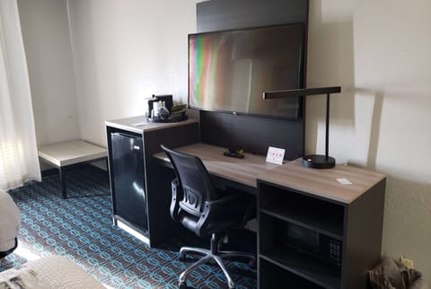 Premium bedding, desk, laptop workspace, iron/ironing board