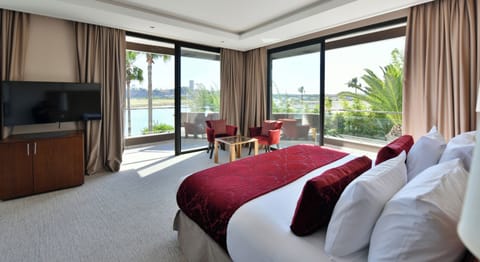 Premium Suite (River View) | Minibar, in-room safe, individually decorated, individually furnished