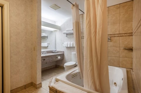 Suite, 1 King Bed, Non Smoking, Jetted Tub (Living Room) | Bathroom | Combined shower/tub, free toiletries, hair dryer, towels