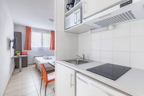 Apartment, 1 Bedroom | Private kitchen | Fridge, microwave, stovetop, highchair