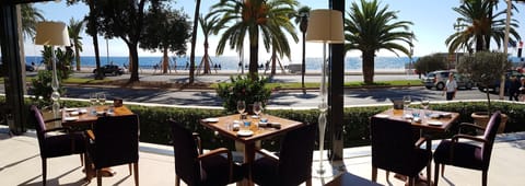 Breakfast, lunch, dinner served; French cuisine, beach views 