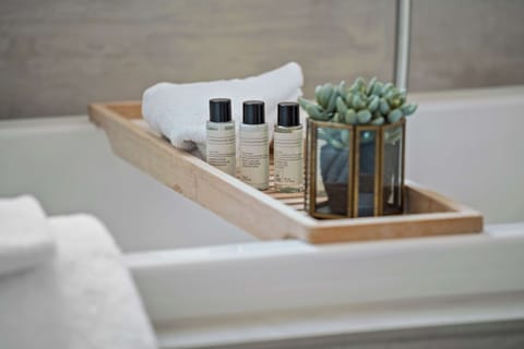 Suite, 1 King Bed, Non Smoking | Bathroom | Shower, hair dryer, towels, soap