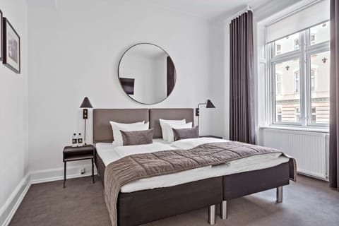 Family Room, 1 King Bed, Non Smoking (with Sofabed) | In-room safe, laptop workspace, blackout drapes, iron/ironing board