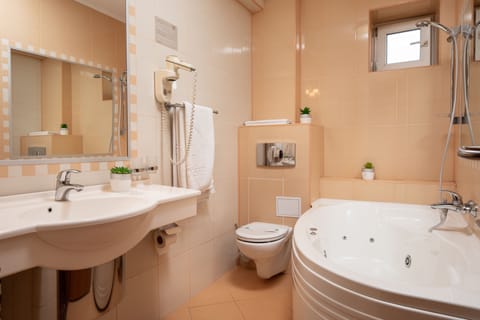 Family Room, Balcony | Bathroom | Jetted tub, free toiletries, hair dryer, bathrobes