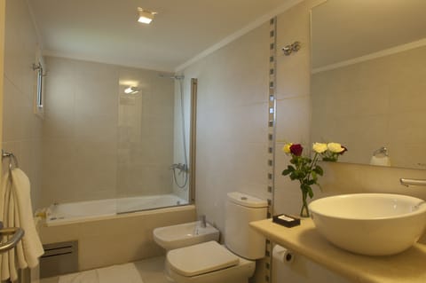 Bathtub, deep soaking tub, eco-friendly toiletries, hair dryer