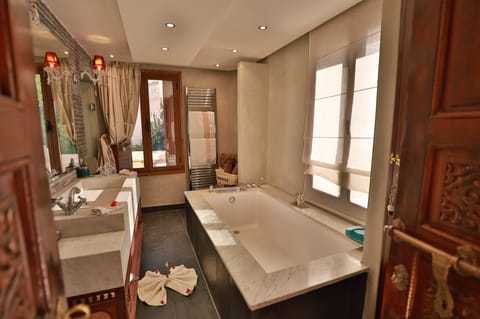 Separate tub and shower, deep soaking tub, designer toiletries