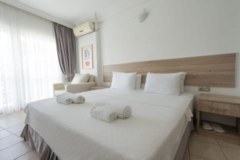 Standard Double Room, Lanai, Partial Sea View | Minibar, free WiFi, bed sheets