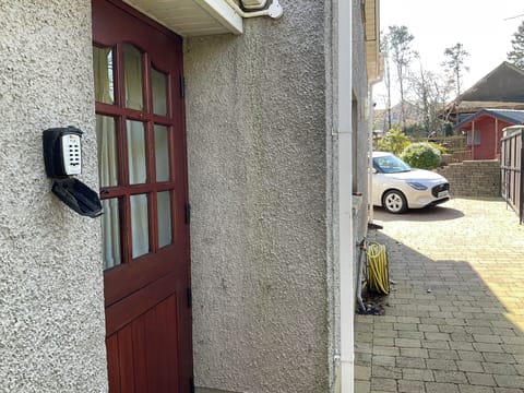 Security box on left of entrance door. Key will be left in box. Opens top lock.