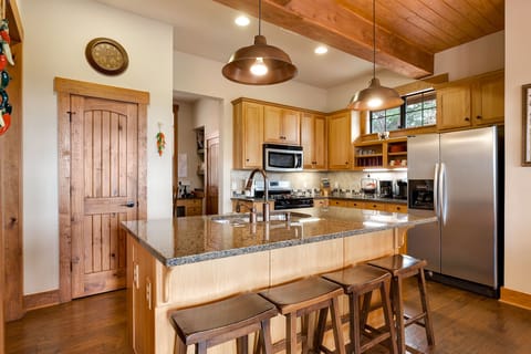 Large double door refrigerator with ice maker, Keurig coffee maker, blender.