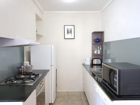 Apartment, 2 Bedrooms | Private kitchen | Full-size fridge, microwave, oven, stovetop