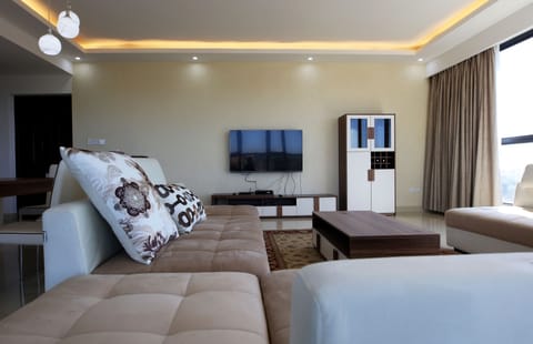 Deluxe Apartment, 3 Bedrooms | Living area | Flat-screen TV