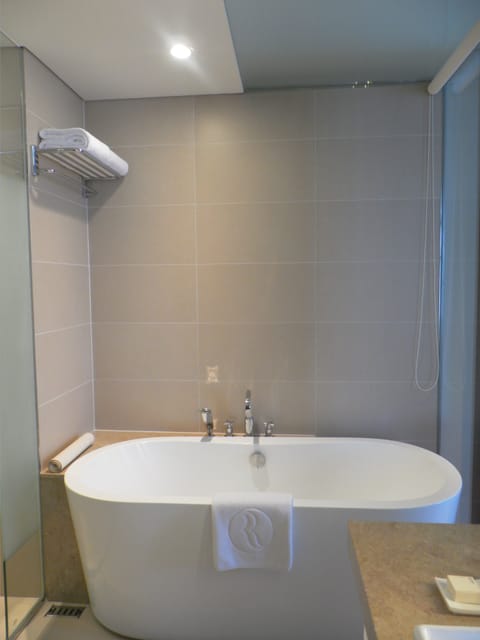 Premier Room, 1 King Bed | Bathroom | Deep soaking tub, designer toiletries, hair dryer, bathrobes